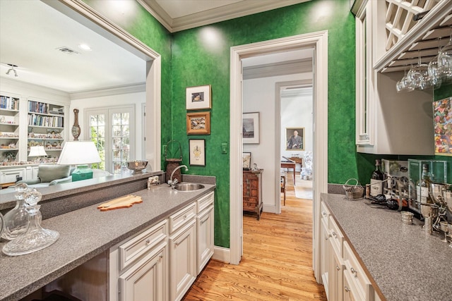 2509 Westgate Dr, Houston, TX 77019 - kitchen featuring ornamental molding and light wood-type flooring