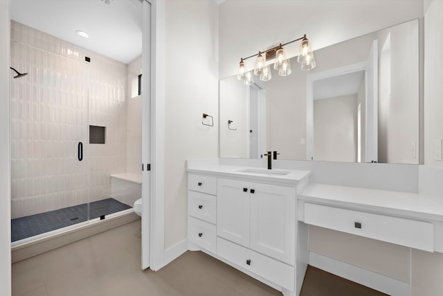 bathroom with an enclosed shower, toilet, and vanity