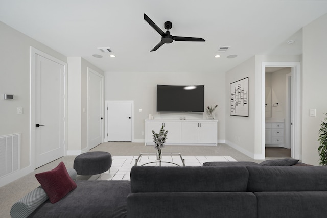 living room with ceiling fan and light carpet