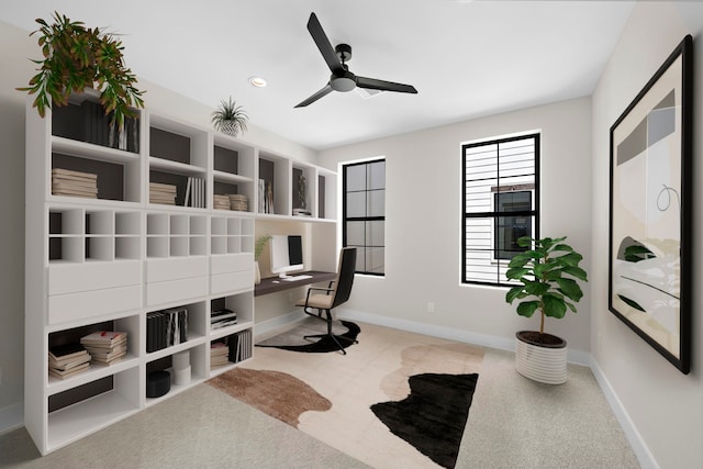 interior space featuring ceiling fan and carpet