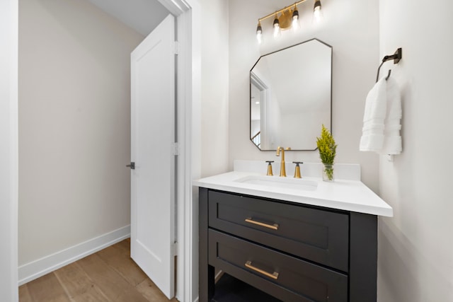 bathroom featuring vanity and hardwood / wood-style floors