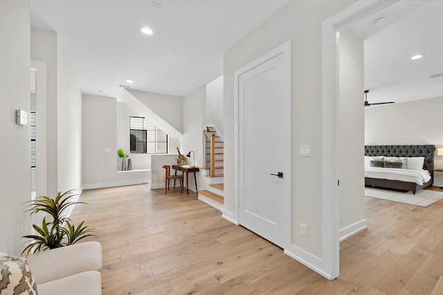 foyer featuring ceiling fan and light hardwood / wood-style flooring