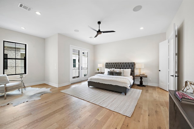 bedroom featuring light hardwood / wood-style flooring, ceiling fan, access to exterior, and french doors