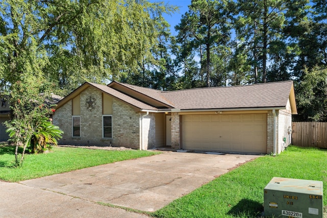 ranch-style house featuring a front yard and a garage