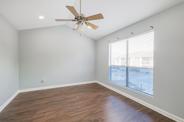 spare room with vaulted ceiling, ceiling fan, and dark hardwood / wood-style flooring