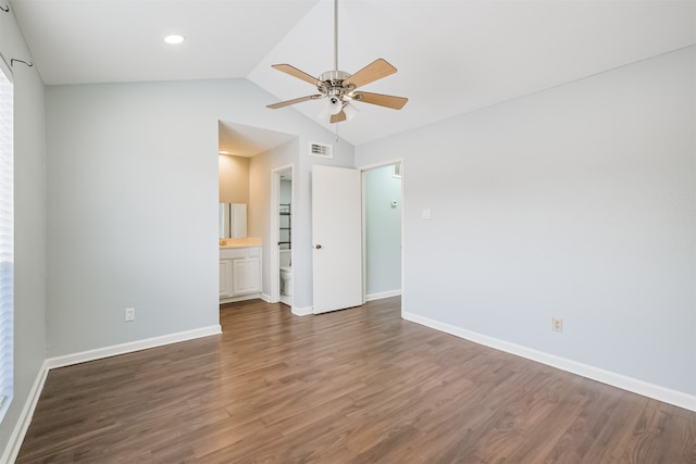 unfurnished room featuring dark wood-type flooring, lofted ceiling, and ceiling fan