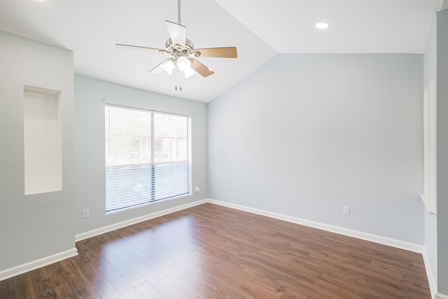 spare room with ceiling fan, dark hardwood / wood-style flooring, and lofted ceiling