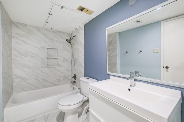 full bathroom featuring toilet, vanity, and tiled shower / bath