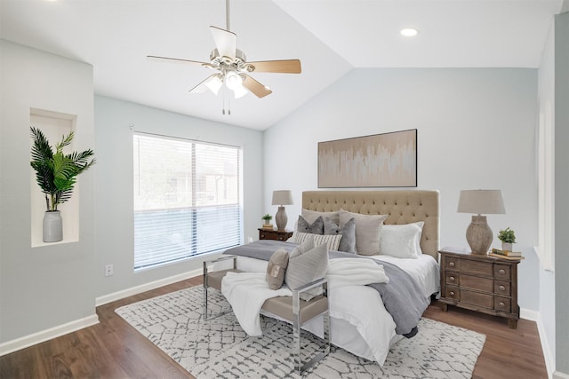 bedroom with ceiling fan, dark hardwood / wood-style flooring, and vaulted ceiling