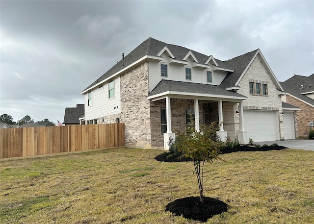 view of front of house featuring a front yard and a garage