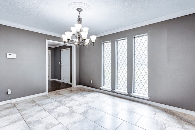 tiled spare room with a textured ceiling, a healthy amount of sunlight, and an inviting chandelier