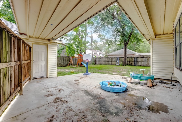 view of patio with a storage shed