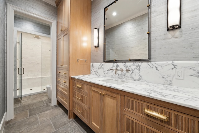 bathroom with walk in shower, toilet, vanity, tasteful backsplash, and ornamental molding