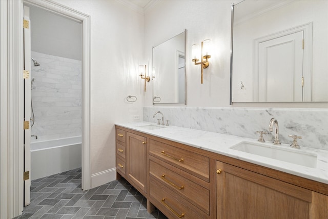 bathroom with tiled shower / bath combo, vanity, and crown molding