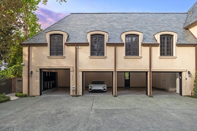 french country home with a garage