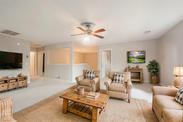 carpeted living room featuring ceiling fan