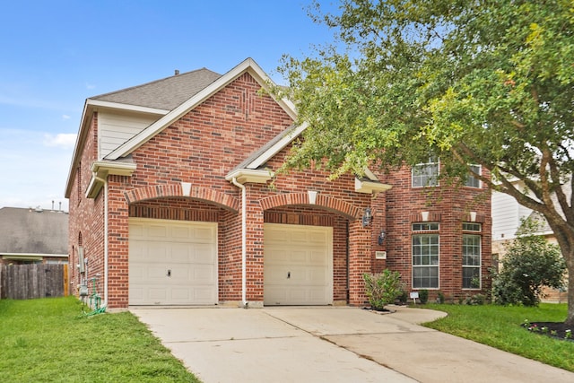 front of property featuring a garage and a front lawn