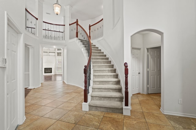 foyer entrance with a towering ceiling