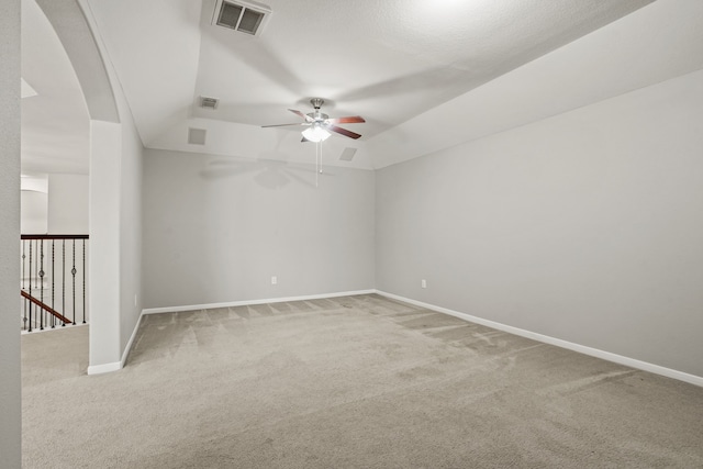 carpeted spare room featuring ceiling fan