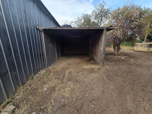 view of outbuilding with a carport