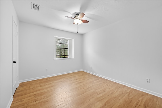 unfurnished room with ceiling fan and light hardwood / wood-style flooring