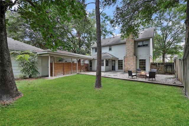 back of house featuring a patio area and a lawn