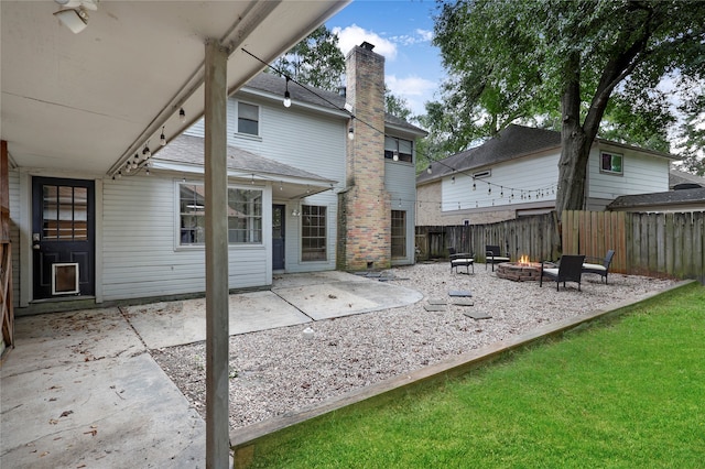 exterior space with a fire pit, a yard, and a patio