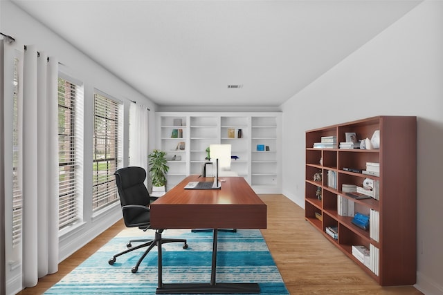 home office with light wood-type flooring