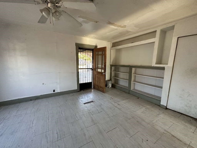 spare room with light hardwood / wood-style flooring and ceiling fan