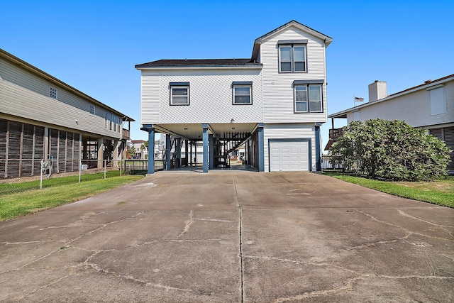 view of front facade featuring a carport and a garage