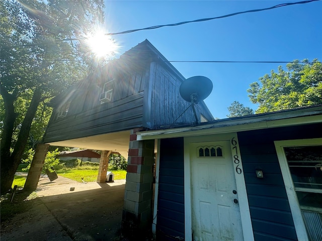 view of home's exterior featuring a carport