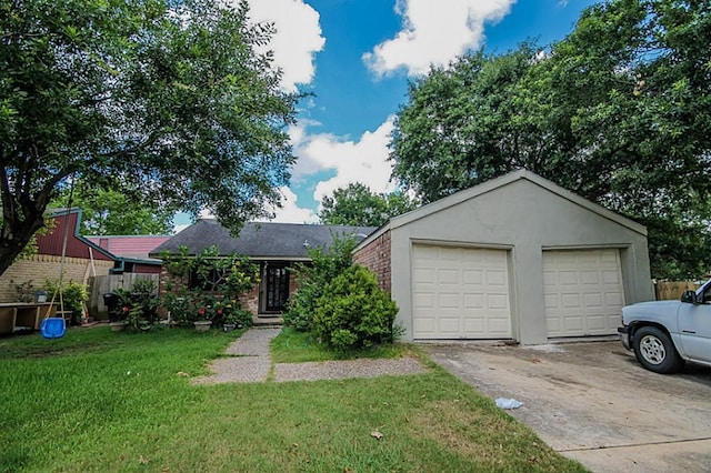 ranch-style home featuring a garage and a front lawn