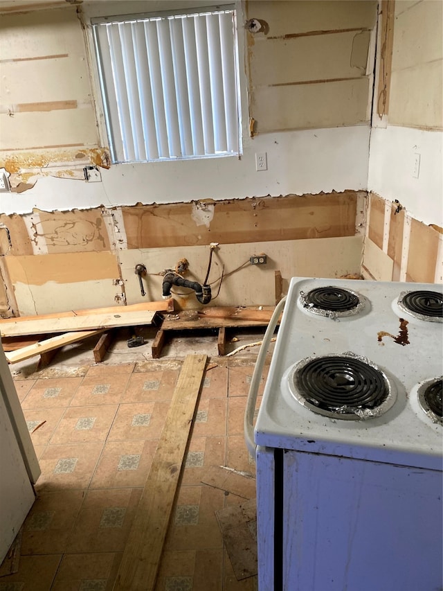 kitchen featuring white range with electric stovetop