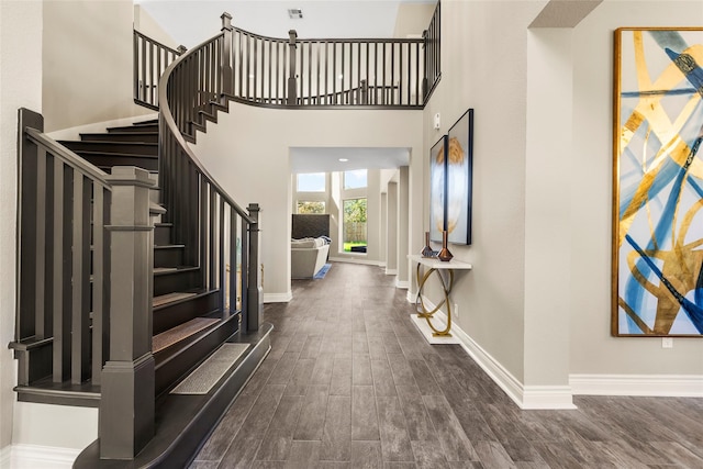 foyer entrance featuring a high ceiling