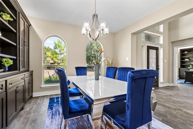 dining room with a chandelier and hardwood / wood-style flooring