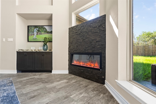 interior details with a stone fireplace