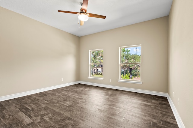 unfurnished room featuring dark hardwood / wood-style floors and ceiling fan