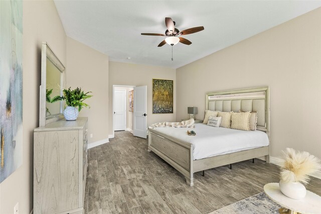 bedroom featuring ceiling fan and hardwood / wood-style flooring