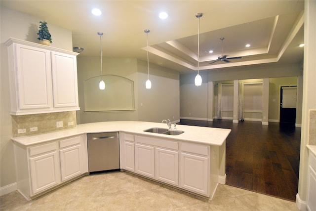 kitchen featuring white cabinetry, ceiling fan, light hardwood / wood-style flooring, stainless steel dishwasher, and sink