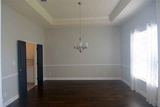 unfurnished dining area with a tray ceiling, crown molding, and dark hardwood / wood-style flooring