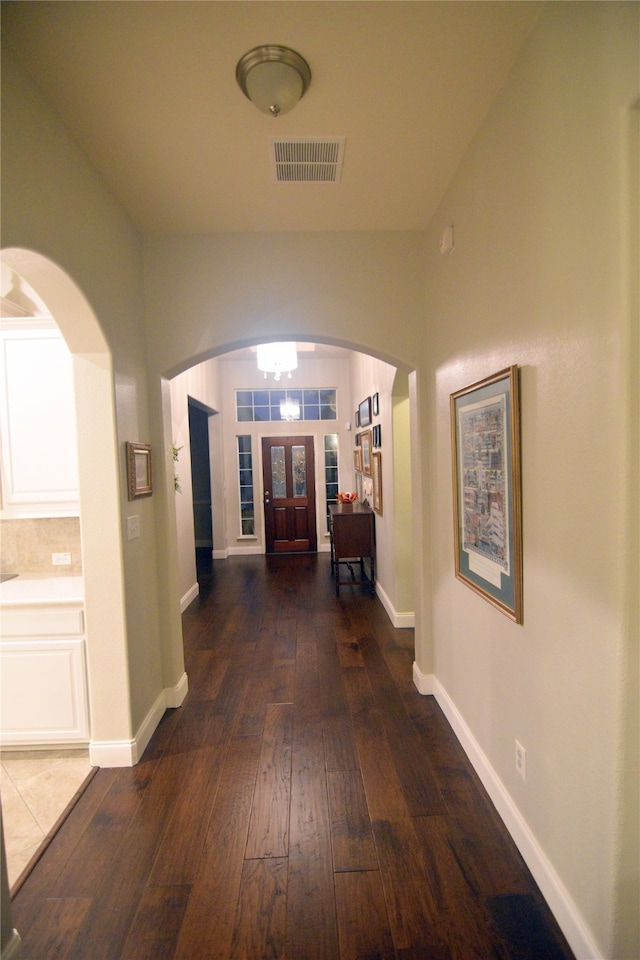 hall with dark hardwood / wood-style floors