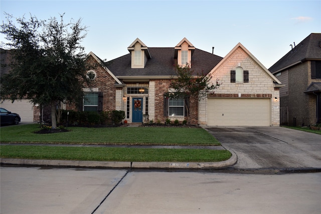 view of front of house with a front lawn and a garage