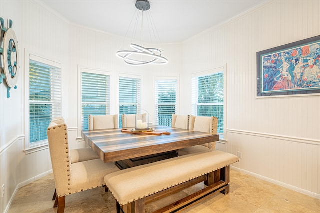 4010 Shallow Reef, Galveston, TX 77554 - dining space featuring crown molding, a chandelier, and baseboards