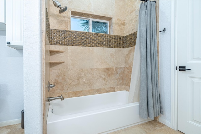 4010 Shallow Reef, Galveston, TX 77554 - bathroom featuring shower / bath combo with shower curtain, baseboards, and a textured wall