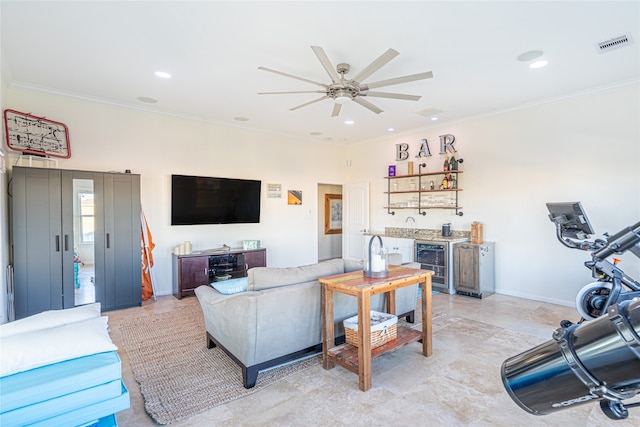 4010 Shallow Reef, Galveston, TX 77554 - living room featuring wine cooler, bar, a ceiling fan, crown molding, and recessed lighting