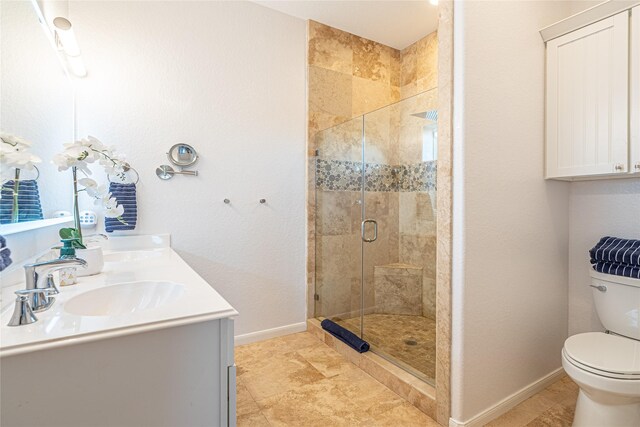 4010 Shallow Reef, Galveston, TX 77554 - full bath with a stall shower, toilet, double vanity, and baseboards