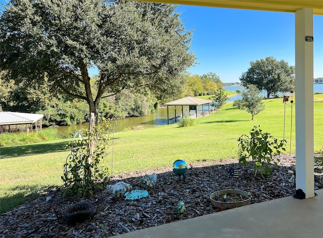 view of yard with a gazebo and a water view