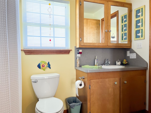 bathroom with toilet and vanity