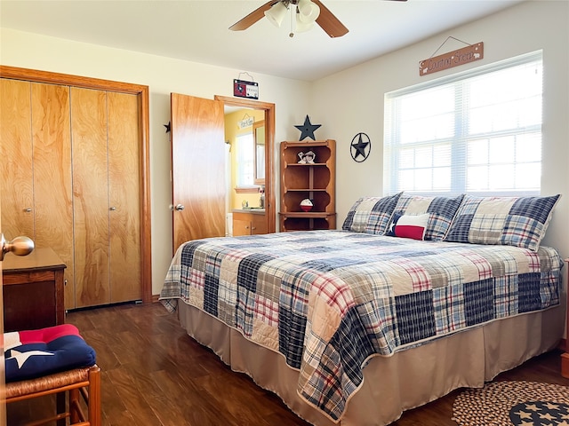 bedroom featuring ceiling fan, dark hardwood / wood-style floors, and a closet