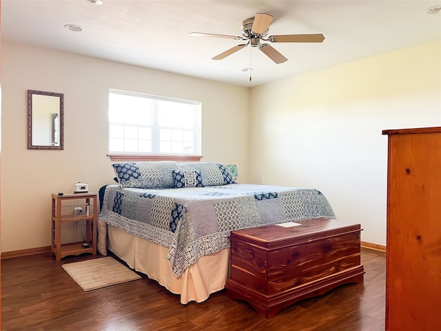 bedroom featuring ceiling fan and dark hardwood / wood-style flooring